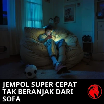 Seorang remaja tenggelam di kursi beanbag, hanya disinari cahaya ponsel, dengan bola sepak yang tak tersentuh di lantai di sampingnya. Keterangan: KECEPATAN JEMPOL ELIT, TIDAK TERDETEKSI DI ATAS SOFA.
