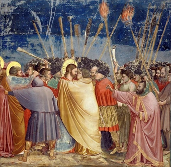 Giotto's fresco 'The Kiss of Judas' (Scrovegni Chapel, Padua, c. 1305): a golden-robed Judas embraces Christ face to face in the act of betraying him, soldiers and torches pressing in around them.