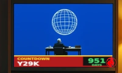 A big-screen TV showing a COUNTDOWN Y29K news chyron