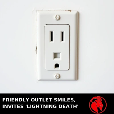 A single-receptacle US electrical wall outlet whose slots and ground hole resemble a friendly smiling face. Caption: Friendly outlet smiles, invites 'Lightning Death'.